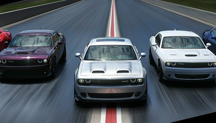 Five 2020 Dodge Challenger SRT models being driven on a track