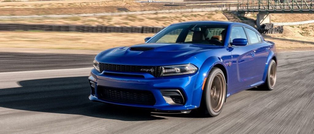 blue dodge charger on a desert road