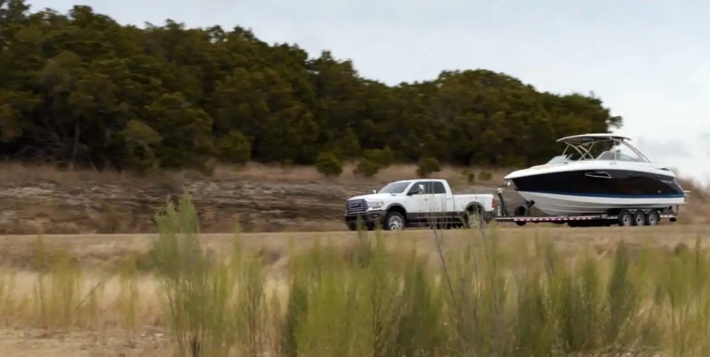 ram truck towing a boat